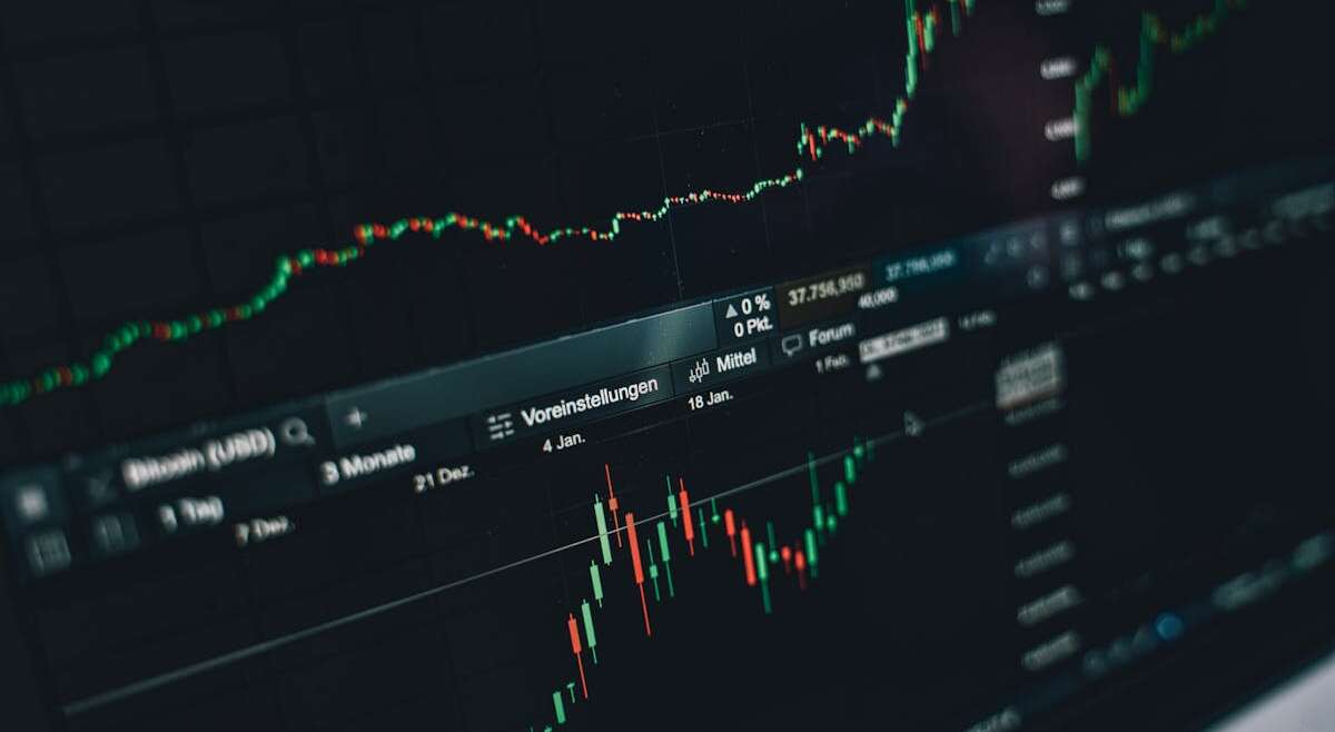 Trading charts and financial data on a monitor