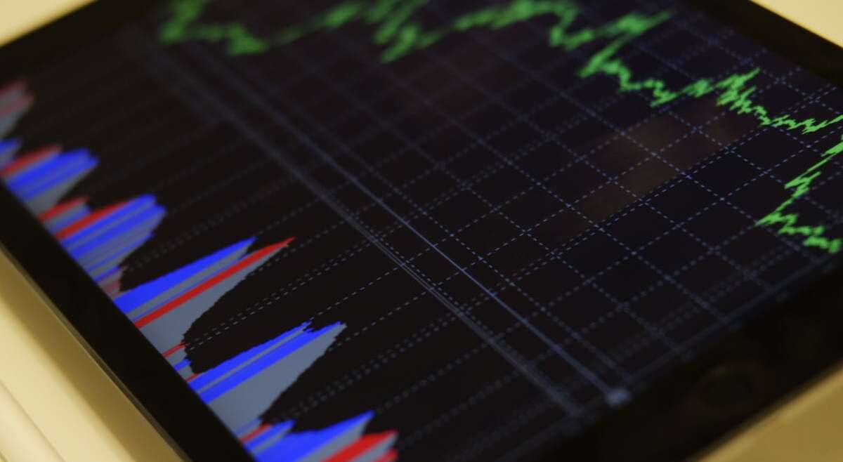 Diversified investment portfolio concept with charts and financial planning
