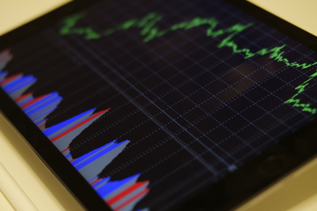 Diversified investment portfolio concept with charts and financial planning